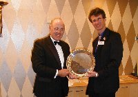 President Keith Levin presents Martin Gardner with the President's Shield for his 2000 flight to Avranches.