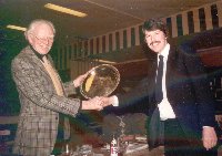 Norman Balfour receives the President's Shield from President 'Ossie' Roberts, 1984