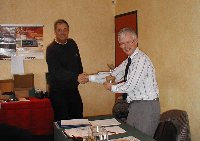 Chairman John Livens presents Chris Wylie with the Bill Morcom Trophy at the 2002 AGM