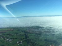 Cheshire looking towards Manchester, early fog lifted into a low layer
