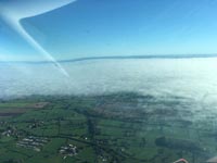 Cheshire looking towards Manchester, early fog lifted into a low layer
