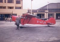 An early colour picture of JV. The pilot is John Cairns, but does any member know which Airfield?
